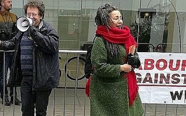 Jackie Walker (right) with Tony Greenstein (left) in front of a Momentum banner outside the Labour Party's HQ