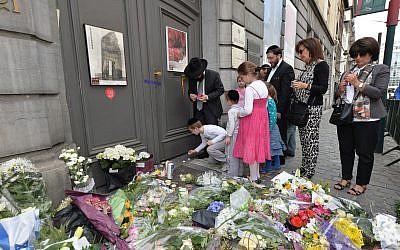 Jewish people at the museum's entrance the day after the killings