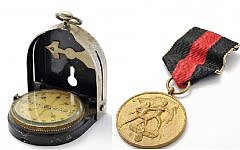 A compass manufactured by Bezard/Gotthilf Lufft, said to have been used by Schindler and his wife Emilie while fleeing Russian troops in 1945 and a 1938 Sudetenland Medal awarded to Schindler, who had aided in the annexation and occupation of the Sudetenland as a spy for the German government