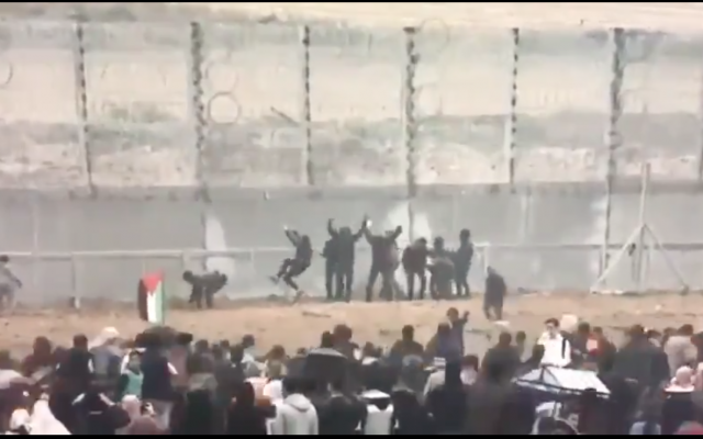 Screenshot from video on Youtube showing Palestinian demonstrators trying to infiltrate the Gaza fence with Israel