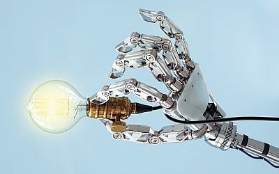 High tech hand with a classic light bulb. How much will AI control its creator?