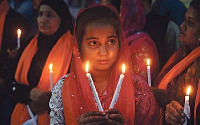 Candles are lit in Pakistan to pay tribute to the Sri Lankan blasts victims, during a vigil in Lahore on April 23, 2019.   (Photo credit ARIF ALI/AFP/Getty Images)