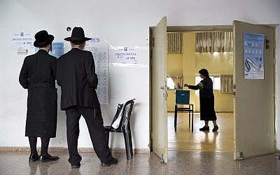 Ultra-Orthodox Jews at a polling station in Bnei Brak, Israel, Tuesday, April 9, 2019. (AP Photo/Oded Balilty)