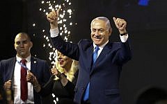 Israel's Prime Minister Benjamin Netanyahu waves to his supporters after polls for Israel's general elections closed in Tel Aviv, Israel, Wednesday, April 10, 2019. (AP Photo/Ariel Schalit) Israel's Prime Minister Benjamin Netanyahu waves to his supporters after polls for Israel's general elections closed in Tel Aviv, Israel, Wednesday, April 10, 2019. (AP Photo/Ariel Schalit)