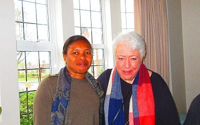 Cheryl Sklan (right) at her home with a refugee guestb