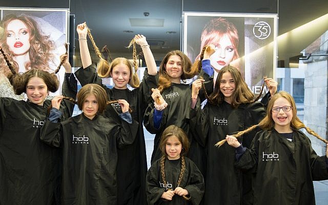 A group of girls had their braids chopped off  to make wigs for Israeli children diagnosed with cancer
