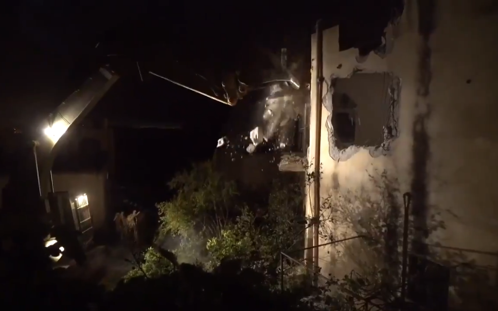 Screenshot from IDF video shows the military demolishing another suspected terrorist, Saleh Barghouti's home, in April