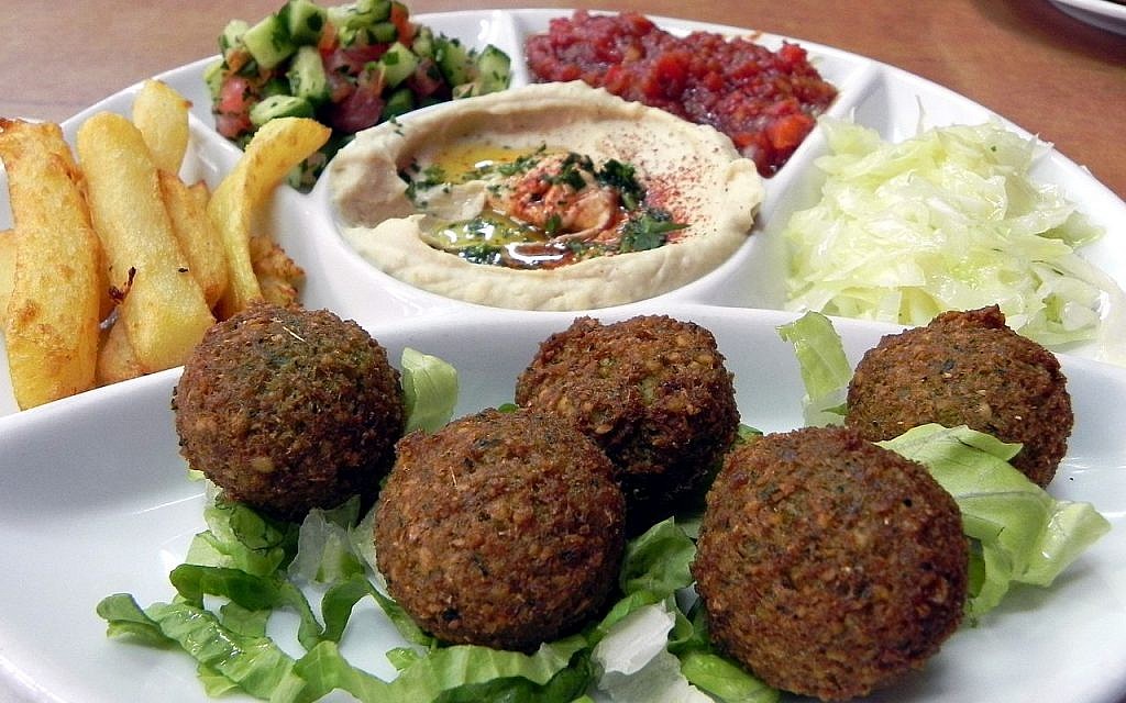 Serving in Jerusalem restaurant including falafel, hummus and Israeli salad, a typically Israeli dish. (young shanahan/Wikipedia)