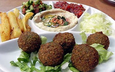 Serving in Jerusalem restaurant including falafel, hummus and Israeli salad, a typically Israeli dish. (young shanahan/Wikipedia)