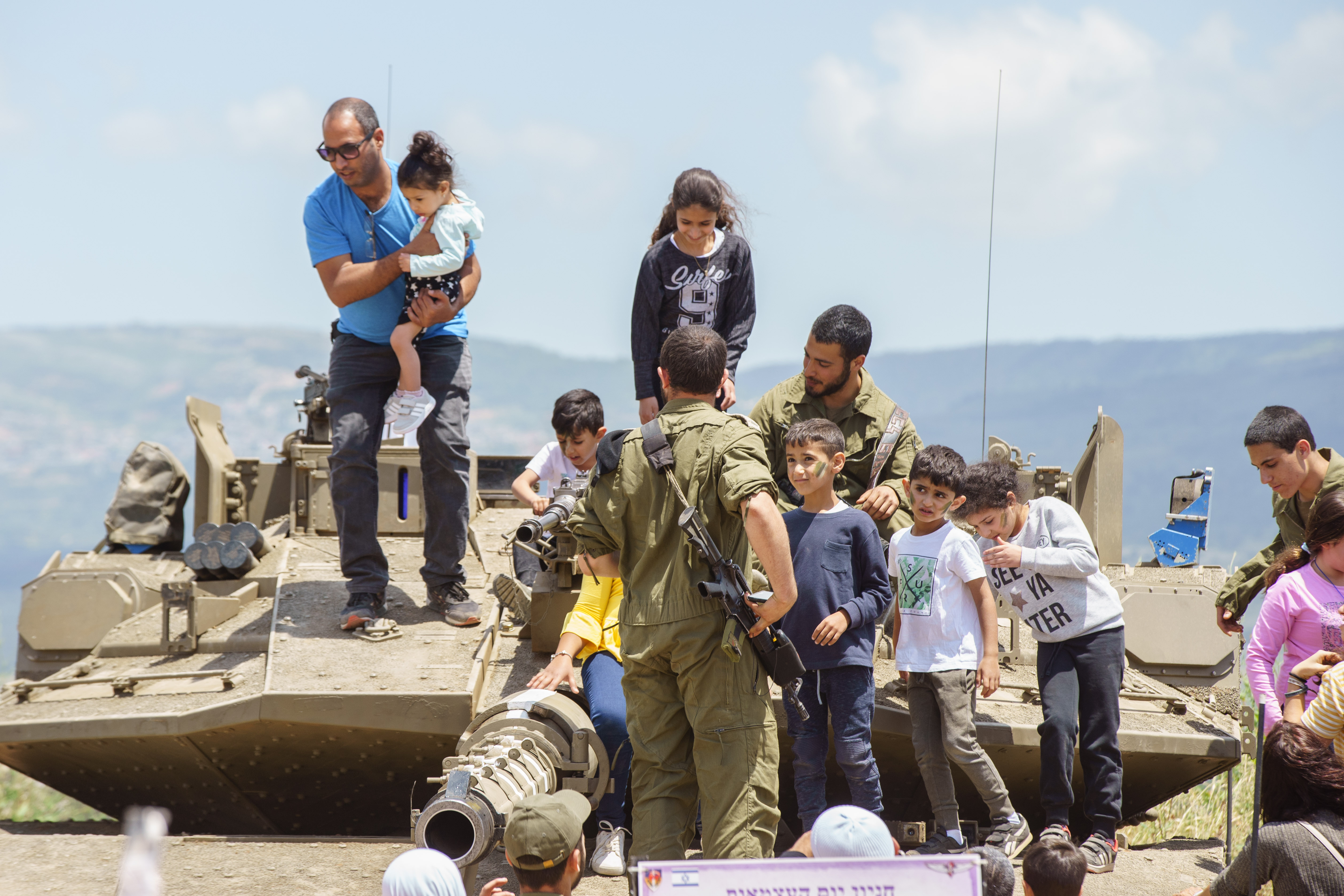 Children in an exhibit of Israeli military weapons during the celebration of the 71st Independence Day near the northern city of Kiryat Shmona, May 9, 2019. Photo by: JINIPIX