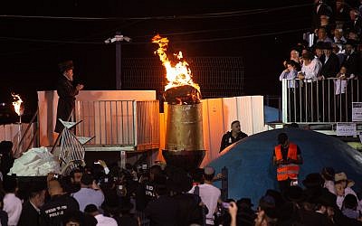 Thousands of orthodox Jews gather at the gravesite of Rabbi Shimon Bar Yochai, on Mt. Meron in Israel's northern Galillee, in traditional celebration of the Jewish Holiday of Lag Ba'omer, early Tuesday morning, May 22, 2019. Lag Ba'omer is celebrated to commemorate the day a plague ended in which thousands of students of Rabbi Akiba, a Talmudic scholar, died. This holiday is traditionally celebrated by the lighting of bonfires and festivities. Mt. Meron is the location for the central event of the evening, attracting approximately 40,000 celebrators every year. Photo By: Gil Eliyahu-JINIPIX