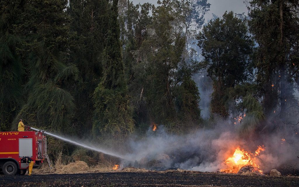 Fire fighters extinguish a forests fire near Kibbutz Harel, Thursday, May 23, 2019. Israeli police have ordered the evacuation of several communities in southern and central Israel as wildfires rage amid a major heatwave. Photo by: JINIPIX