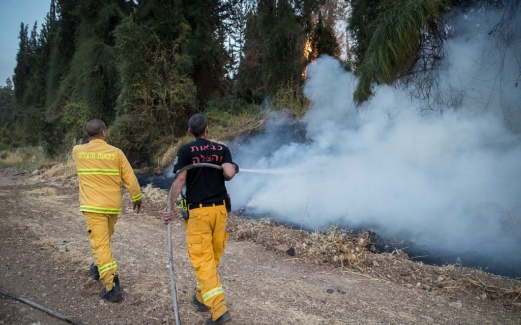 Fire fighters extinguish a forests fire near Kibbutz Harel, Thursday, May 23, 2019. Israeli police have ordered the evacuation of several communities in southern and central Israel as wildfires rage amid a major heatwave. Photo by: JINIPIX