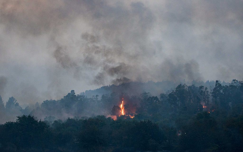 Fire fighters extinguish a forests fire near Kibbutz Harel, Thursday, May 23, 2019. Israeli police have ordered the evacuation of several communities in southern and central Israel as wildfires rage amid a major heatwave. Photo by: JINIPIX