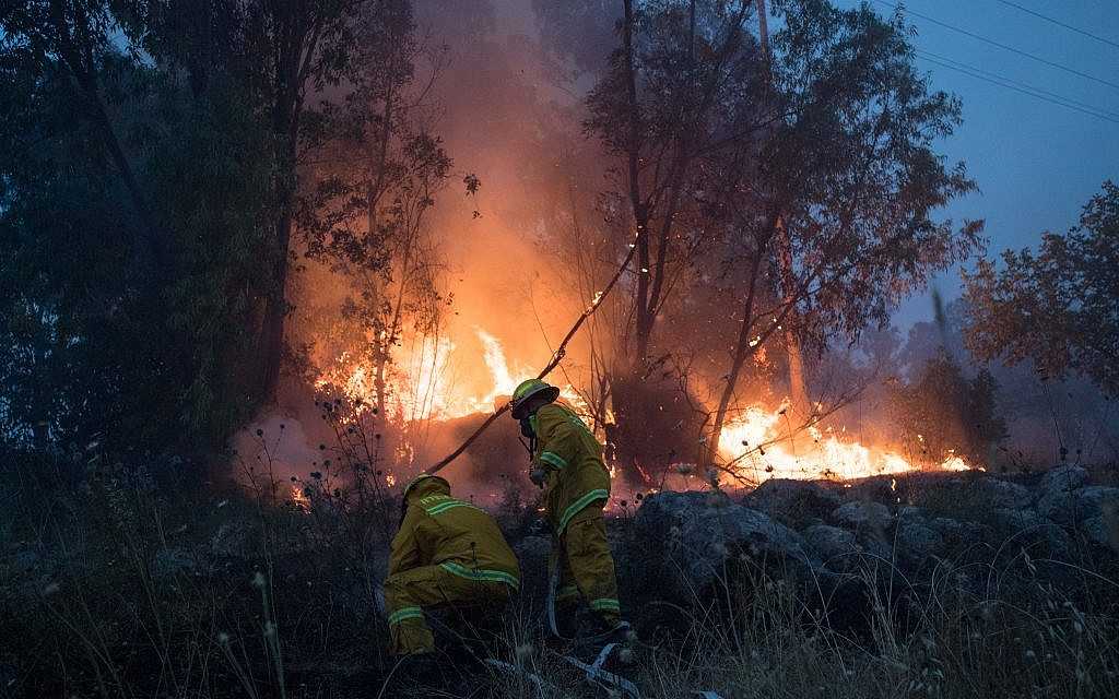 Fire fighters extinguish a forests fire near Kibbutz Harel, Thursday, May 23, 2019. Israeli police have ordered the evacuation of several communities in southern and central Israel as wildfires rage amid a major heatwave. Photo by: JINIPIX