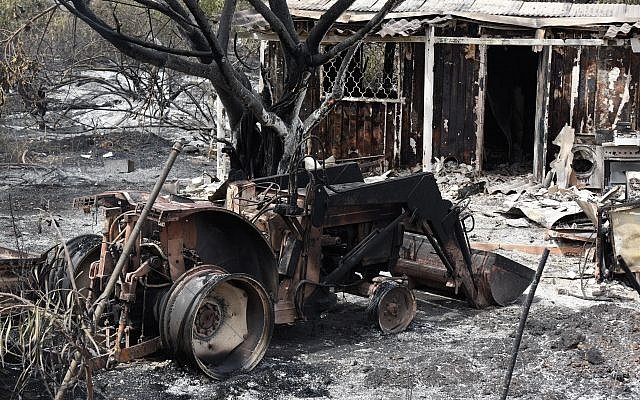 A destroyed agricultural machinery following a fire amidst extreme heat wave in the village of Mevo Modi'im, in central Israel on May 24, 2019. Photo by: JINIPIX