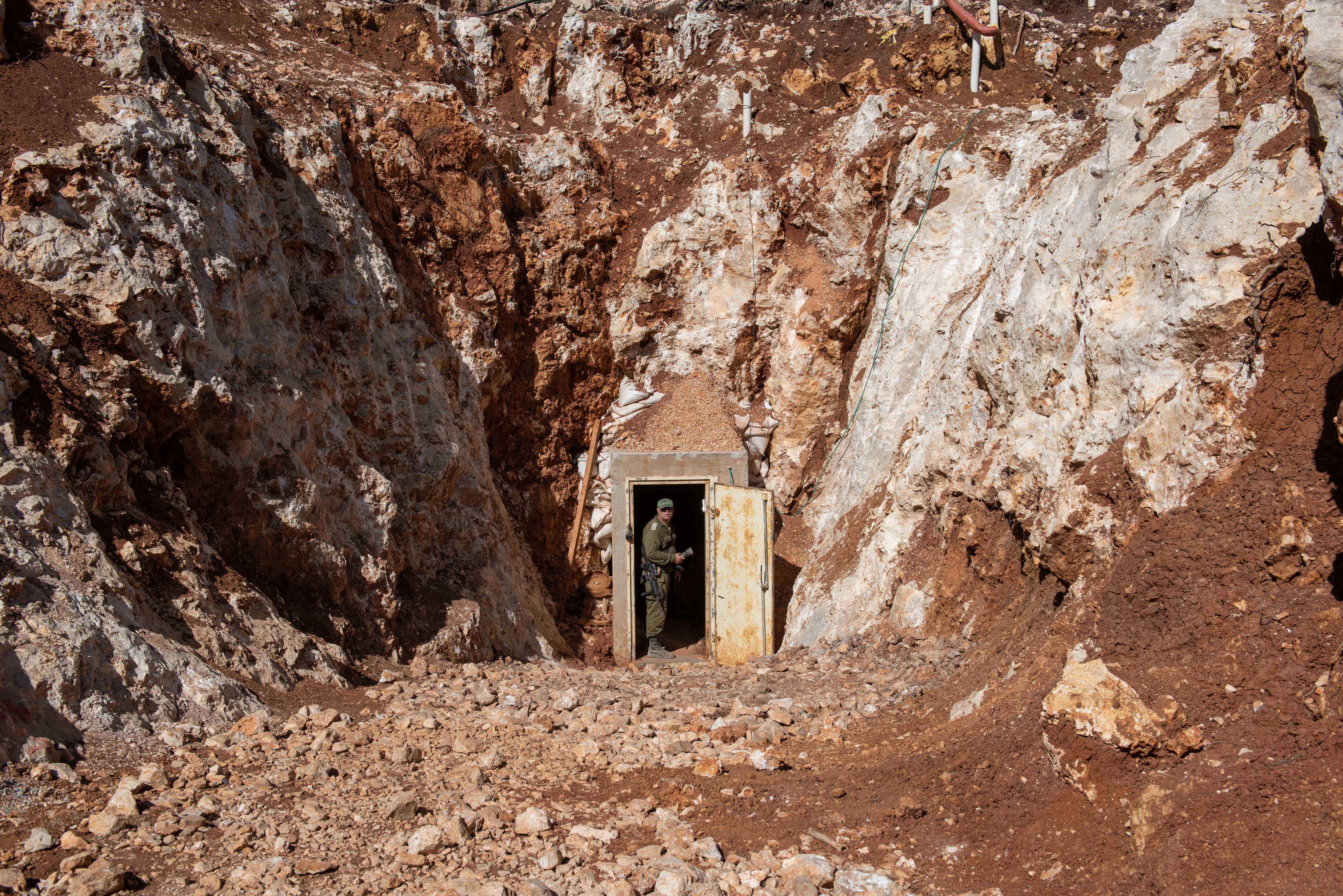 An Israeli soldier stands at the enterance of a Hezbollah tunnel that crosses from Lebanon to Israel, on the border between Israel and Lebanon in northern Israel, on May 29, 2019. Photo by: Ayal Margolin-JINIPIX