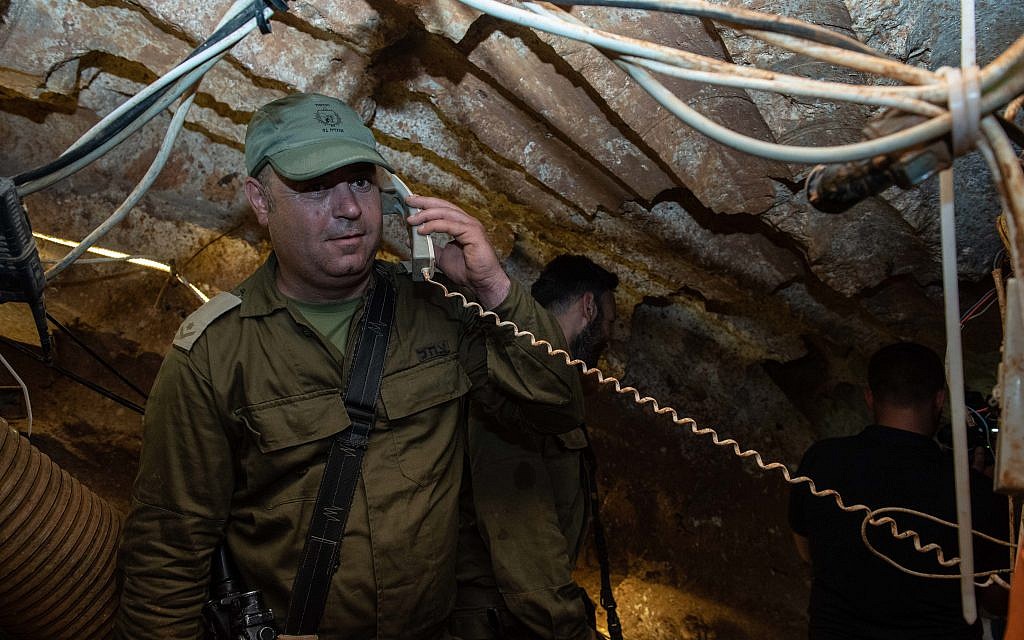 An Israeli soldier holding a telephone receiver that has been installed inside a Hezbollah tunnel that crosses from Lebanon to Israel, on the border between Israel and Lebanon in northern Israel, on May 29, 2019. Photo by: Ayal Margolin-JINIPIX