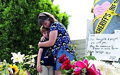 Heather Fay with her son Marshall came with flowers and notes at the memorial site across Chabad of Poway synagogue, while some of the eyewitnesses from the horrific incident gave a brief to media.
Credit: Nick Oza/The Arizona Republic via USA TODAY NETWORK/Sipa USA Heather Fay with her son Marshall came with flowers and notes at the memorial site across Chabad of Poway synagogue, while some of the eyewitnesses from the horrific incident gave a brief to media.
Credit: Nick Oza/The Arizona Republic via USA TODAY NETWORK/Sipa USA