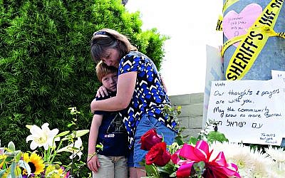 Heather Fay with her son Marshall came with flowers and notes at the memorial site across Chabad of Poway synagogue, while some of the eyewitnesses from the horrific incident gave a brief to media. 

Credit: Nick Oza/The Arizona Republic via USA TODAY NETWORK/Sipa USA