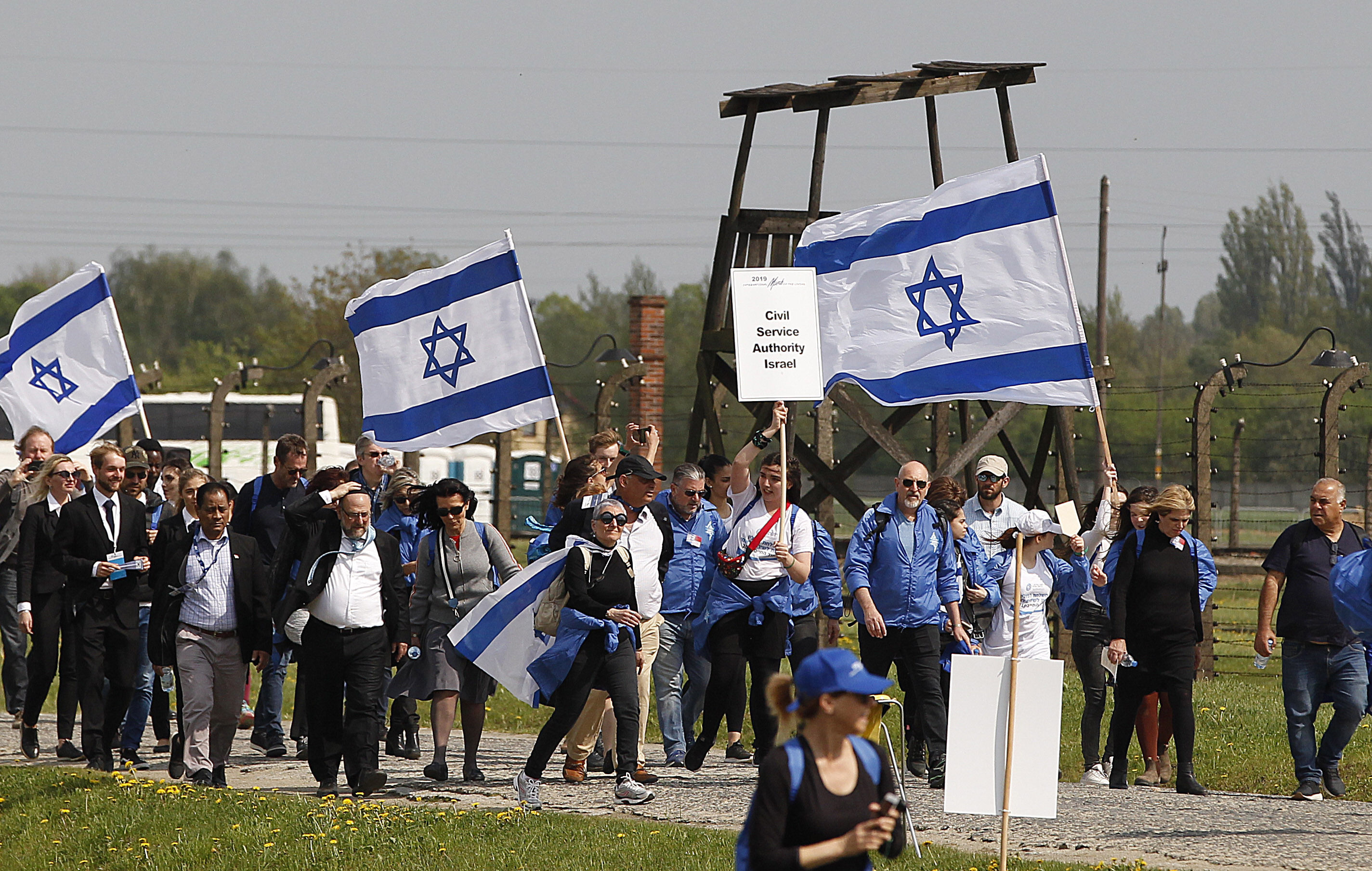 Young Jews from around the world walk with Israeli flags through the former Nazi German death camp of Auschwitz-Birkenau during the annual Holocaust remembrance event, the "March of the Living" in memory of the six million Holocaust victims in Oswiecim, Poland, Thursday, May 2, 2019.(AP Photo/Czarek Sokolowski)