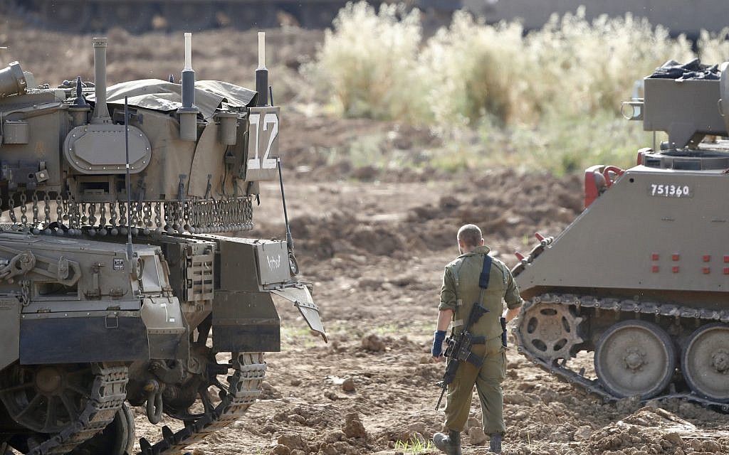 An Israeli soldier stands at a gathering point in Israel Gaza Border, Monday, May 6, 2019. (AP Photo/Ariel Schalit)