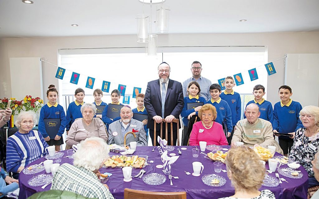 Jewish Care volunteers opening their home to Chief Rabbi Ephraim Mirvis and pupils from Moriah school earlier this year.