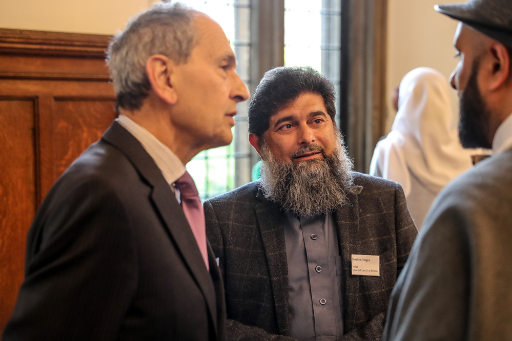 Sir Bernard Rix of Coexist House (left) speaking with Ibrahim Mogra and  (Marc Morris Photography)