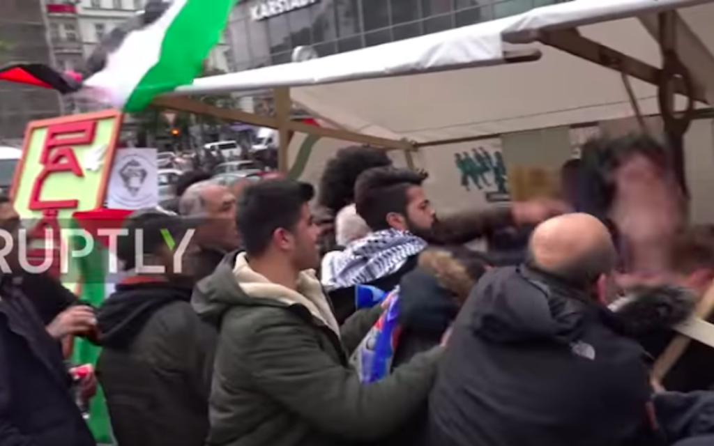 A video shows a man being attacked at an anti-Israel event in Berlin. (Ruptly via YouTube)