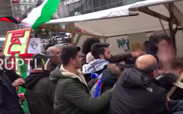 A video shows a man being attacked at an anti-Israel event in Berlin. (Ruptly via YouTube)