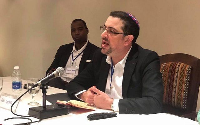 Rabbi Alex Goldberg addressing a conference
