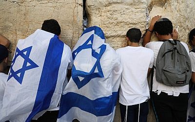 Jewish men pray at the Western Wall in Jerusalem Old City during Yom Yerushalayim (Jerusalem Day), June 2, 2019. Photo by: JINIPIX