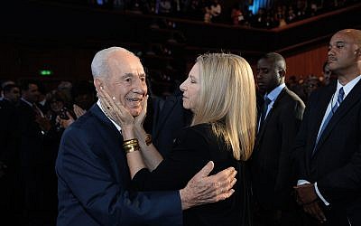 Singer Barbra Streisand hugs late Israeli President Shimon Peres   (Photo by Kobi Gideon/GPO via Getty Images)