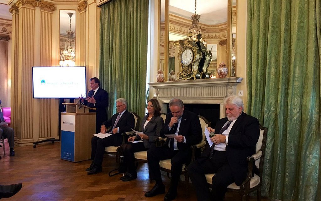 Sir Alan Duncan MP (second from left) at the Argentinian Embassy in London's event to remember the Jewish centre bombing, as  Argentinian Ambassador Carlos Sersale di Cerisano addresses guests.