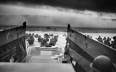 Into the Jaws of death - Omaha Beach, June 6, 1944. By Robert F. Sargent.

(National Archives and Records Administration (www.archives.gov)/Wikipedia/Chief Photographer's Mate (CPHoM) Robert F. Sargent)