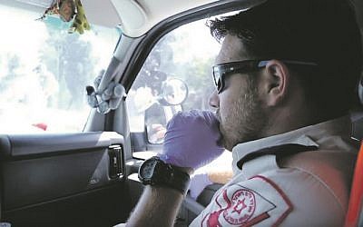 Magen David Adom medic on his way to an emergency in East Jerusalem