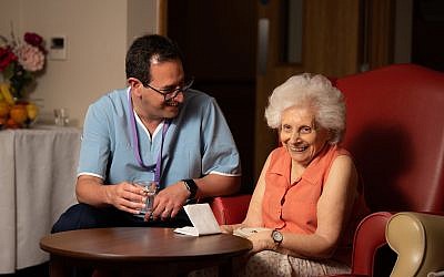 Daniel Carmel-Brown at Jewish Care's Otto Schiff home in Golders Green, with resident Rita Tack (left) (Blake Ezra Photography)