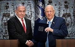 Israeli President Reuven Rivlin (R) hands a letter of appointment for entrusted with forming the next government to Israeli Prime Minister and Chairman of the Likud Party Benjamin Netanyahu (L) at the President's residence in Jerusalem, Israel, 25 September 2019.  . Photo by: JINIPIX
