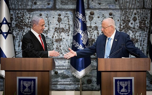 Israeli President Reuven Rivlin (R) hands a letter of appointment for entrusted with forming the next government to Israeli Prime Minister and Chairman of the Likud Party Benjamin Netanyahu (L). Photo by: JINIPIX