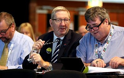 Len McCluskey, General Secretary of Unite the union (left), during the TUC Congress in Brighton. On the left, an attendant wears a pro-Palestine landyard. (PA Photo.(Photo credit: Gareth Fuller/PA Wire)