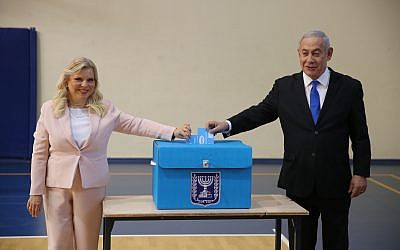 Israeli Prime Minister Benjamin Netanyahu (R) and his wife Sara Netanyahu (L) cast their ballots during the Israeli legislative elections, at a polling station in Jerusalem, 17 September 2019. . Photo by: Alex kolomoisky-JINIPIX