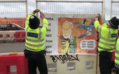 Police take down controversial poster depicting Bibi Netanyahu targeting Jeremy Corbyn, as seen at Labour conference (Theo Usherwood on Twitter)