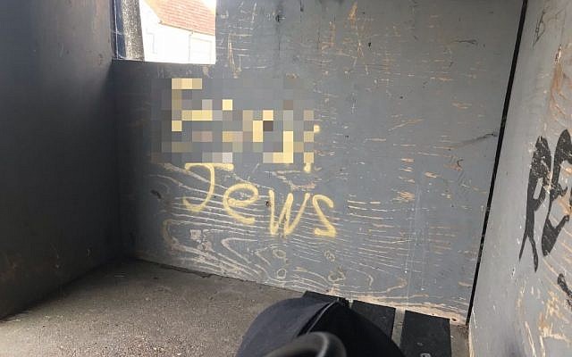 Antisemitic graffiti was discovered on a bus shelter in West Sussex. It has been pixelated in this picture. Picture credit:  Jonathan Swain
