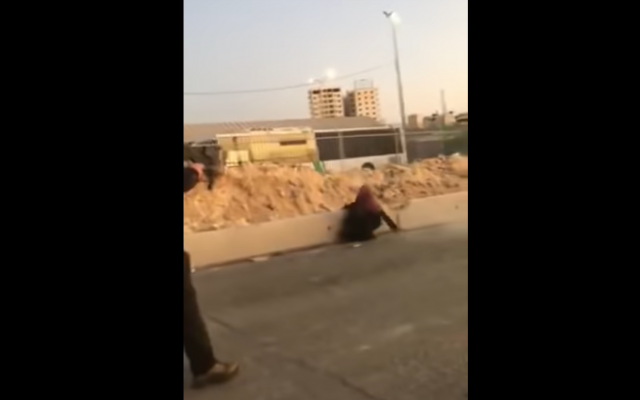 Screenshot from video showing a Palestinian woman wielding a knife and being shot dead