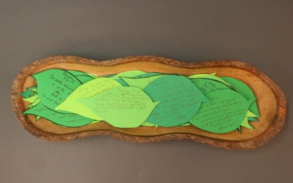 A wooden bowl holding notes of condolence shaped like leaves, sent by a church in Pittsburgh following the synagogue shooting. (Courtesy of the Tree of Life Congregation and Rauh Jewish History Program & Archives)