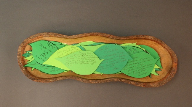 A wooden bowl holding notes of condolence shaped like leaves, sent by a church in Pittsburgh following the synagogue shooting. (Courtesy of the Tree of Life Congregation and Rauh Jewish History Program & Archives)