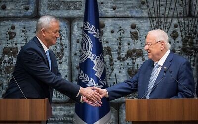 Israeli President Reuven Rivlin (R) hands a letter of appointment for entrusted with forming the next government to leader of the Blue and White political party Benny Gantz (L) at the President's residence in Jerusalem, Israel, 23 October 2019.  Photo by: JINIPIX
