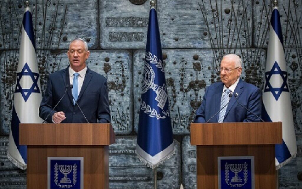 Israeli President Reuven Rivlin (R) hands a letter of appointment for entrusted with forming the next government to leader of the Blue and White political party Benny Gantz (L) at the President's residence in Jerusalem, Israel, 23 October 2019.  Photo by: JINIPIX