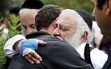 Rabbi Yisroel hugs a member of the congregation of Chabad of Poway the day after a deadly shooting took place there, on Sunday, April 28, 2019 in Poway, Calif. (Credit Image: © TNS via ZUMA Wire)
