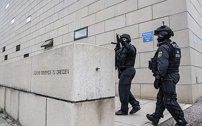 Police officers secure a synagogue in Dresden, Germany, Wednesday, Oct. 9, 2019.  (Robert Michael/dpa via AP)